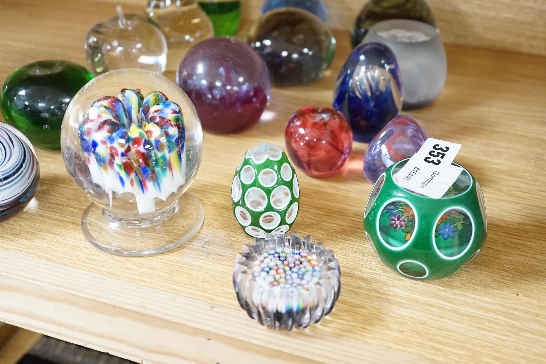 A collection of mixed paperweights to include a faceted floral Perthshire example, other Scottish floral and millefiori examples (Qty), tallest 12cms high